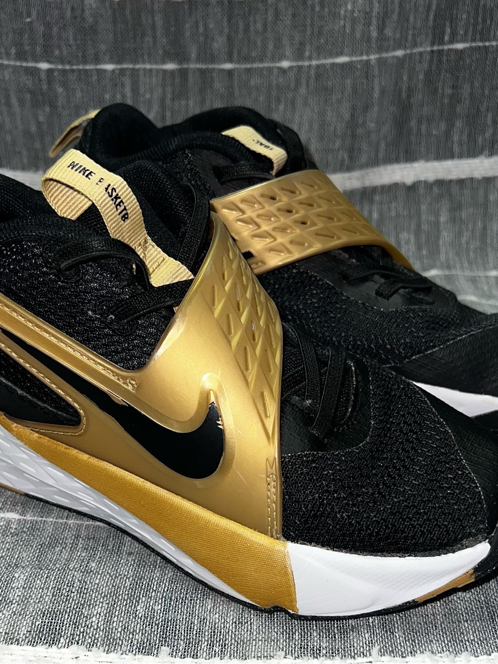 Nike Children’s Black and Gold Slip-On Training Sneakers